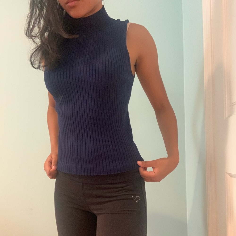 Blue sleeveless turtleneck